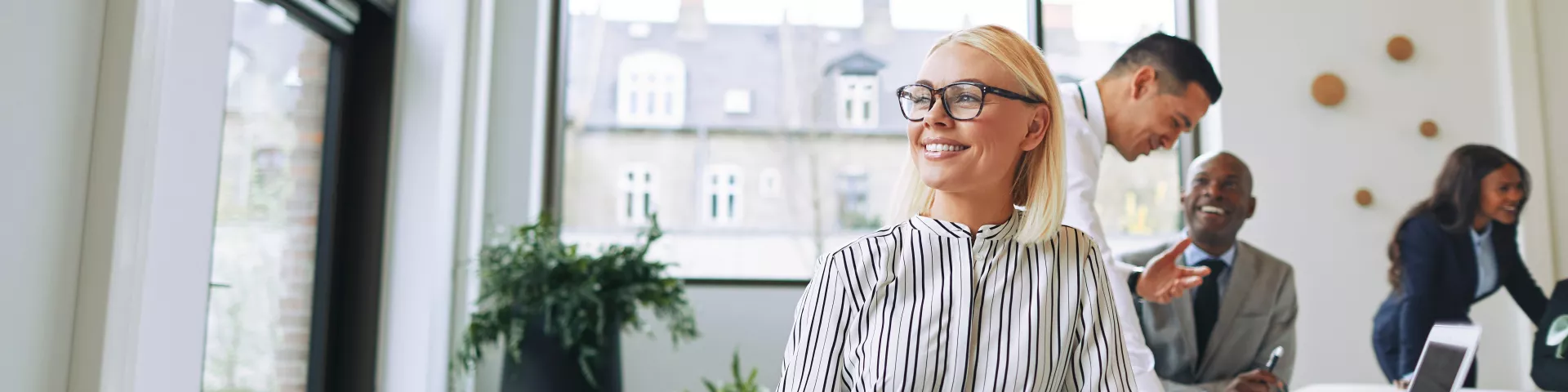 Smiling in a bright office_banner